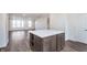 Open concept kitchen island with white countertop and wooden cabinets at 1836 Blenker Dr, Carmel, IN 46032