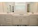 Double vanity bathroom with light cabinets and tile floors at 19243 Foley Dr, Westfield, IN 46074