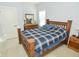 Cozy bedroom with wood framed bed, dresser, and ample natural light at 19243 Foley Dr, Westfield, IN 46074