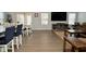 Open concept dining area with hardwood floors, large TV, and comfortable seating at 19243 Foley Dr, Westfield, IN 46074