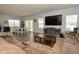 Spacious living room features hardwood floors, large TV, and comfortable seating at 19243 Foley Dr, Westfield, IN 46074