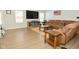 Comfortable living room featuring sectional sofa and large TV at 19243 Foley Dr, Westfield, IN 46074