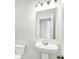 Small bathroom with pedestal sink and toilet at 19426 Northwest Blvd, Westfield, IN 46074