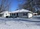 Snow-covered house exterior with a deck and yard at 2116 N Rosewood Ave, Muncie, IN 47304