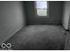 Empty bedroom with gray carpeting and a window at 2435 N Eaton Ave, Indianapolis, IN 46219