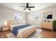 Bright bedroom with hardwood floors and a light wood platform bed at 2521 Cicero Rd, Noblesville, IN 46060