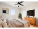 Modern bedroom with hardwood floors and a dresser at 2521 Cicero Rd, Noblesville, IN 46060