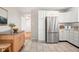 Modern kitchen with stainless steel appliances and light wood cabinets at 2521 Cicero Rd, Noblesville, IN 46060