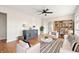 Bright living room with hardwood floors, comfortable seating, and built-in shelves at 2521 Cicero Rd, Noblesville, IN 46060