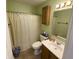 Clean bathroom with shower/tub combo and wood vanity at 3332 Lauren Dr, Indianapolis, IN 46235