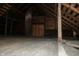 Unfinished attic space with wooden beams and brick chimney at 3469 N Capitol Ave, Indianapolis, IN 46208