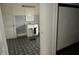 Small bathroom with white vanity and patterned floor at 3469 N Capitol Ave, Indianapolis, IN 46208