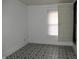 Bright bedroom with geometric patterned floors and a window at 3469 N Capitol Ave, Indianapolis, IN 46208