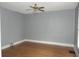 Simple bedroom with gray walls, hardwood floors and ceiling fan at 3469 N Capitol Ave, Indianapolis, IN 46208