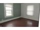 Empty bedroom with wood floors and green walls at 3469 N Capitol Ave, Indianapolis, IN 46208