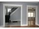 Entryway with hardwood floors, staircase, and views into other rooms at 3469 N Capitol Ave, Indianapolis, IN 46208