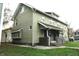 Two story house with green siding, steps and a small yard at 3469 N Capitol Ave, Indianapolis, IN 46208