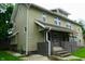 Two story home with siding, framed windows, and a concrete porch with stairs at 3469 N Capitol Ave, Indianapolis, IN 46208