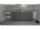 Kitchen with gray cabinets, granite countertops and tile backsplash at 3469 N Capitol Ave, Indianapolis, IN 46208
