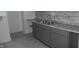 Kitchen with gray cabinets, granite countertops and tile backsplash at 3469 N Capitol Ave, Indianapolis, IN 46208