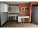 White kitchen cabinets and orange walls at 3469 N Capitol Ave, Indianapolis, IN 46208