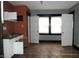 Kitchen with white cabinets and orange walls at 3469 N Capitol Ave, Indianapolis, IN 46208