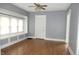 Living room with hardwood floors, gray walls, and window seat at 3469 N Capitol Ave, Indianapolis, IN 46208