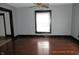 Hardwood floors and a window in the living room at 3469 N Capitol Ave, Indianapolis, IN 46208
