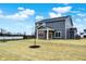 Gray house with covered patio and backyard at 4070 Railhead Ave, Westfield, IN 46074