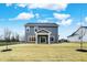 Gray house with covered patio and backyard at 4070 Railhead Ave, Westfield, IN 46074