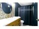 Stylish bathroom with modern vanity, decorative mirror and herringbone accent wall at 4351 Village Parkway W Cir # 5, Indianapolis, IN 46254