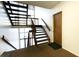 Indoor condo stairwell with wood railings and natural light at 4351 Village Parkway W Cir # 5, Indianapolis, IN 46254