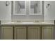 Double vanity bathroom with light wood cabinets at 4652 Kimmeridge Ln, Indianapolis, IN 46254