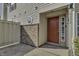 Inviting exterior entrance with red door and brick accents at 4652 Kimmeridge Ln, Indianapolis, IN 46254