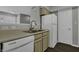 Kitchen with light wood cabinets, stainless steel sink, and dishwasher at 4652 Kimmeridge Ln, Indianapolis, IN 46254