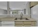 Kitchen features a double sink and modern faucet fixtures at 4652 Kimmeridge Ln, Indianapolis, IN 46254