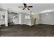 Open living room and kitchen area with dark floors at 4652 Kimmeridge Ln, Indianapolis, IN 46254