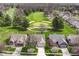 Stunning aerial view of homes overlooking a lush green golf course at 4842 Ashbrook Dr, Noblesville, IN 46062