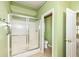 Bathroom showcasing tiled shower with glass doors and a toilet room for privacy at 4842 Ashbrook Dr, Noblesville, IN 46062