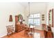 Bright dining area with vaulted ceilings, hardwood floors, and view of the home's backyard at 4842 Ashbrook Dr, Noblesville, IN 46062