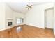 Spacious living room boasts hardwood floors, a fireplace, and large windows offering scenic views at 4842 Ashbrook Dr, Noblesville, IN 46062