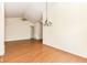 Spacious living room with hardwood floors and a chandelier, creating a bright and inviting space at 4842 Ashbrook Dr, Noblesville, IN 46062