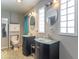 Double vanity bathroom with glass countertops and a toilet at 502 W 38Th St, Indianapolis, IN 46208