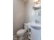 Updated bathroom features a pedestal sink, toilet and shower/tub combo at 502 W 38Th St, Indianapolis, IN 46208