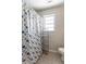 Bathroom with shower/tub and small window at 502 W 38Th St, Indianapolis, IN 46208