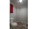 Small bathroom with toilet and damaged flooring at 502 W 38Th St, Indianapolis, IN 46208