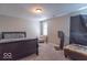 Spacious bedroom with carpeted floor and window at 502 W 38Th St, Indianapolis, IN 46208