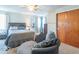 Main bedroom with a comfortable seating area and large closet at 502 W 38Th St, Indianapolis, IN 46208