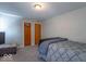 Bedroom with carpet, double closet, and window at 502 W 38Th St, Indianapolis, IN 46208