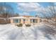 Ranch style home with snow covered lawn at 502 W 38Th St, Indianapolis, IN 46208